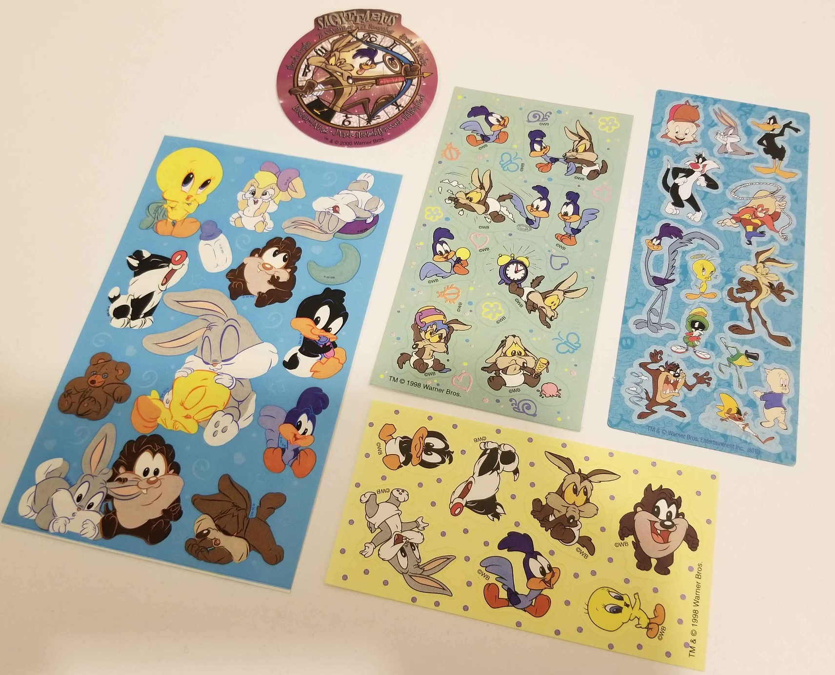 A flat lay of a collection of Looney Tunes stickers.